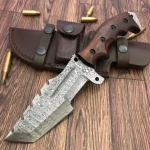 Elevate your outdoor adventure with this hand-forged Damascus steel hunting knife, crafted for serious hunters, survivalists, and knife collectors. Featuring a rugged hammered finish and a razor-sharp edge, this knife is as tough as it is beautiful. Blade Length: 5.5 inches Handle Length: 5 inches (Rosewood Grip with Finger Grooves) Total Length: 10.5 inches Includes: Premium stitched leather sheath Blade Material: Damascus steel, hammered and hand-finished Handle Material: Rosewood with steel rivets and ergonomic grip Purpose: Ideal for hunting, camping, Bush craft, and tactical use Handmade: Each knife is individually hand-crafted Whether you’re in the wild or on display, this knife brings unmatched functionality and craftsmanship. A perfect gift for knife collectors and outdoor enthusiasts! Note: This knife is handmade, so minor variations in texture and finish are part of its uniqueness. Never Sale under 18 year,